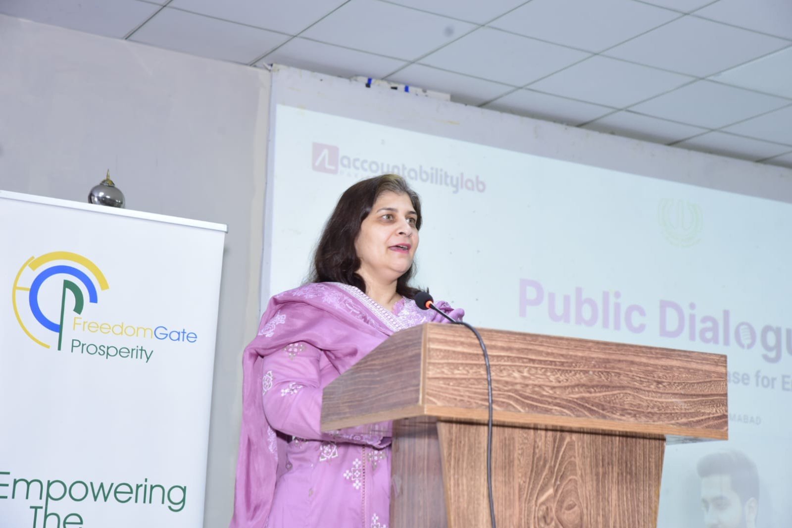 Keynote speaker addressing participants at the public dialogue